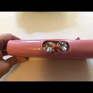 Pink use twice Ted Baker wallet.